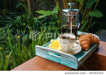 Cup of coffee with croissant 66482383