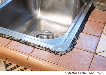 Mildew mold developed on kitchen sink silicon seal 66482572