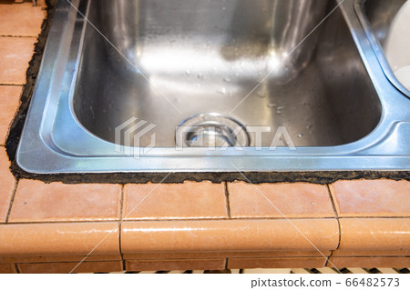 Mildew mold developed on kitchen sink silicon seal 66482573