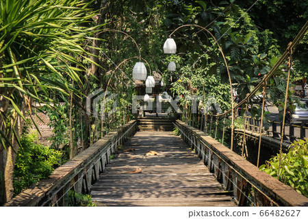 Old wooden bridge in Ubud, Bali. 66482627