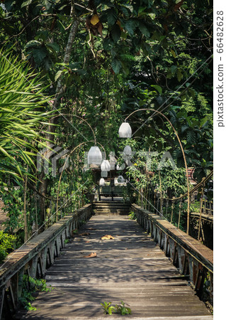 Old wooden bridge in Ubud, Bali. 66482628