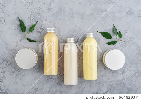 Bottles with spa cosmetic products on grey 66482937