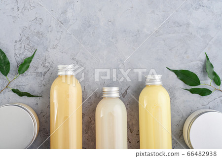 Bottles with spa cosmetic products on grey 66482938