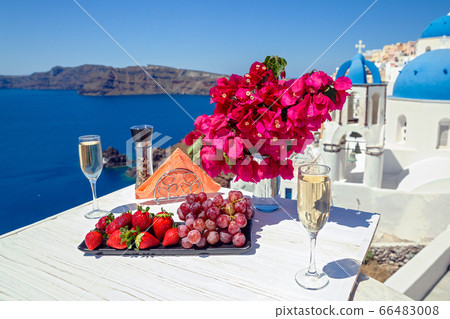 Wine and fruit on the table for two Wine and fruit on the table for two 66483008