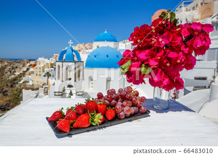 Fresh fruit and flowers on a wooden table Fresh fruit and flowers on a wooden table 66483010