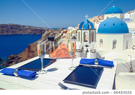 Two glasses of wine on a wooden table Two glasses of wine on a wooden table 66483026