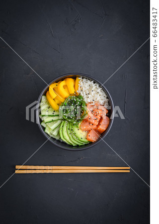 Hawaiian salmon poke bowl with seaweed 66483417