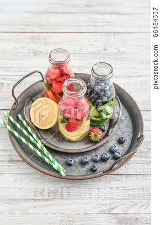 Infused water with fresh fruits Infused water with fresh fruits 66484337