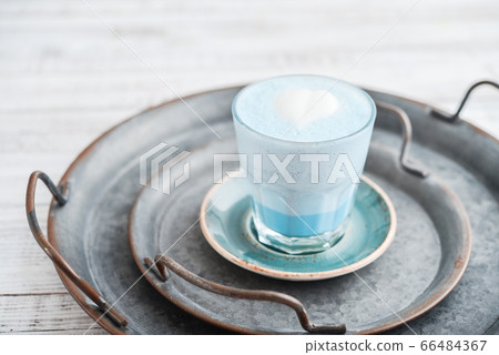 Blue matcha latte in glass 66484367