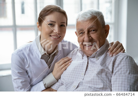 Head shot portrait smiling female doctor and older patient Head shot portrait smiling female doctor and older patient 66484714