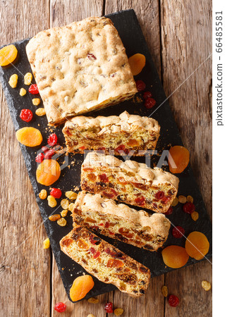 Festive fruit pie with dried apricots berries 66485581