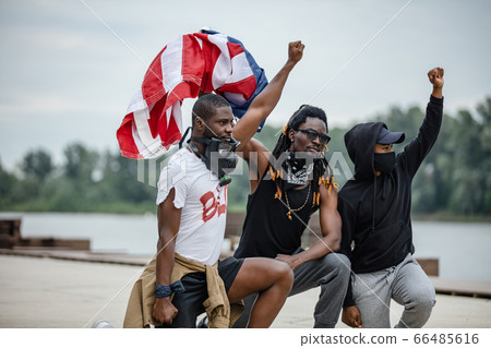 portrait of armed afroamerican men on demonstration 66485616