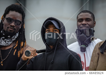 three peaceful smiling armed men look at camera three peaceful smiling armed men look at camera 66485624