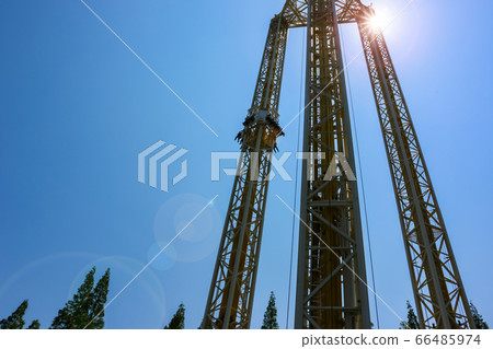 Amusement park rides in vacation day 66485974