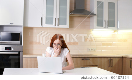 Frustrated woman working from home on her computer Frustrated woman working from home on her computer 66487334