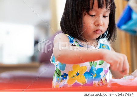 Asian girl home schooling sewing Asian girl home schooling sewing 66487484