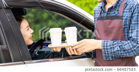 Panoramic Waiter deliver food throght drive thru Panoramic Waiter deliver food throght drive thru 66487583