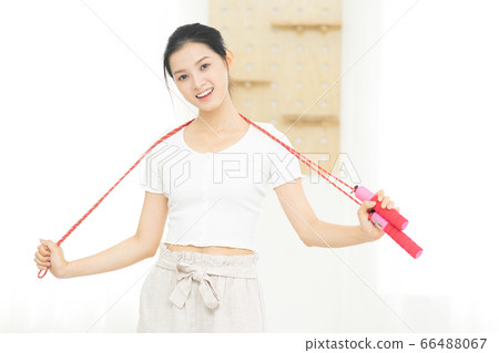 Beautiful woman doing exercise at home Beautiful woman doing exercise at home 66488067