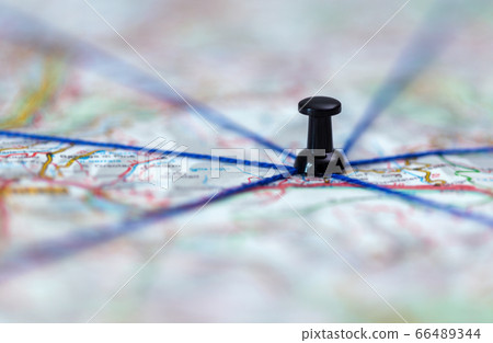 The black pin marks a location on a map with routes The black pin marks a location on a map with routes 66489344