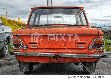 Bright red soviet retro car ZAZ or Zaporozhets. Bright red soviet retro car ZAZ or Zaporozhets. 66489409