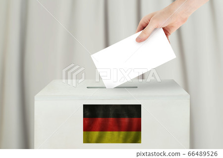 Germany Vote concept. Voter hand holding ballot Germany Vote concept. Voter hand holding ballot 66489526