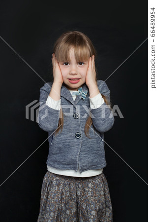 Sad unhappy child on black background portrait Sad unhappy child on black background portrait 66489954