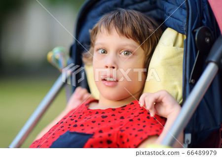 Portrait of a cute little disabled girl  66489979