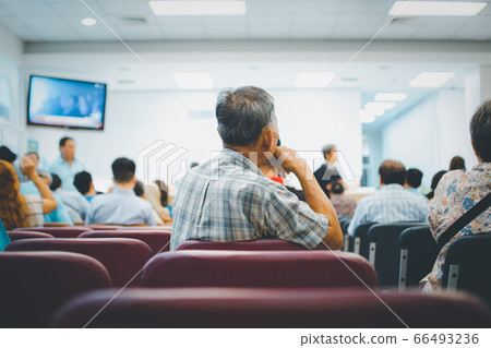 Patients wait doctor in hospital for medical care 66493236