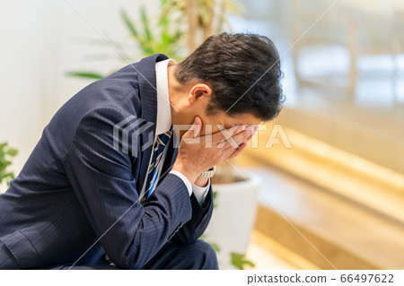 A businessman over the face 66497622