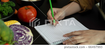 Close up view of female student taking recipe 66497993