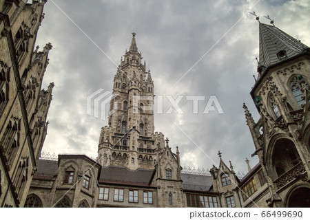 Old-fashioned architectural buildings against grey cloudy sky in Munich, Germany. Old-fashioned architectural buildings against grey cloudy sky in Munich, Germany. 66499690