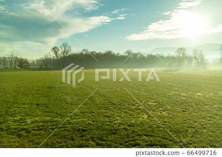 Morning sunny rural landscape with agricultural fields and areas, Austria. Morning sunny rural landscape with agricultural fields and areas, Austria. 66499716