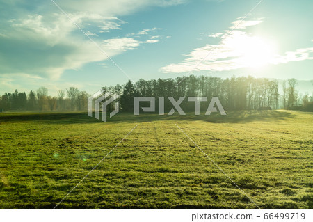 Autumn landscape with farm agricultural fields and blue sky, Austria. Autumn landscape with farm agricultural fields and blue sky, Austria. 66499719