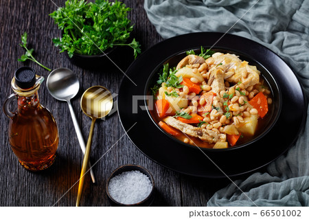 a portion of bean, vegetables and pork stew a portion of bean, vegetables and pork stew 66501002