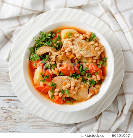white bean, vegetables pork stew in a bowl 66501007