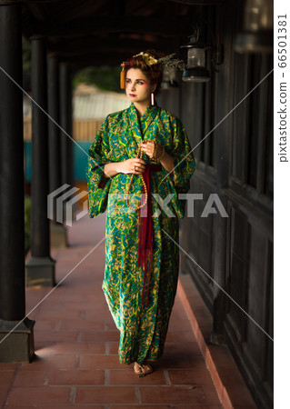 Beautiful woman in Geisha kimono 66501381