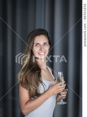Indoor portrait of a woman with wine Indoor portrait of a woman with wine 66501858