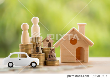 Carton model sedan car and rows of rising coins with US dollar bags, home, Couple. Concept finance and car loan, refinance, cash repayment, Investment and business 66501994