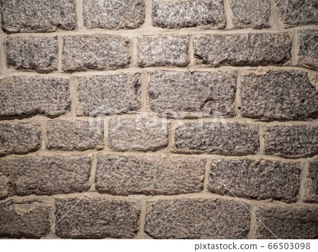 Old brick wall, old texture of gray stone blocks closeup 66503098
