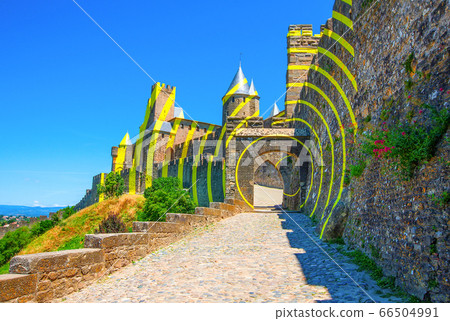 Carcassonne castle illuminated by the solar rays. 66504991