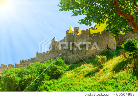 Carcassonne castle illuminated by the solar rays. Carcassonne castle illuminated by the solar rays. 66504992