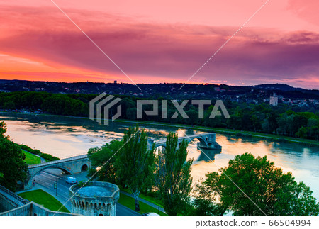 Avignon old bridge and colorful sunset in Provence 66504994