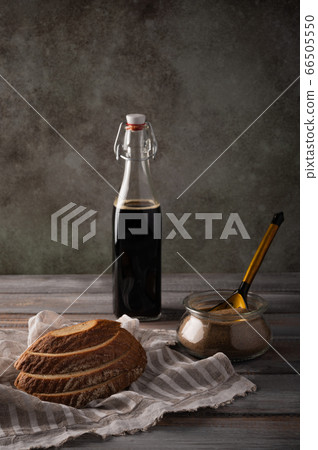 Homemade tradishional russian kvass with leaven and bread on napkin. Wonderful drink for summer Homemade tradishional russian kvass with leaven and bread on napkin. Wonderful drink for summer 66505550