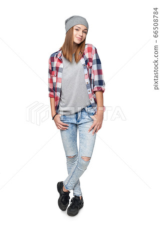 Smiling relaxed teen girl standing in full length 66508784