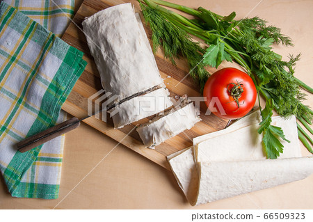 Pieces of cutted pita bread or lavash roll with 66509323