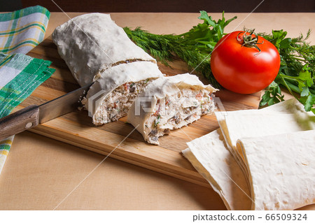 Pieces of cutted pita bread or lavash roll with 66509324