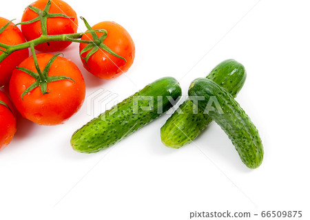 Bunch of red tomatoes and several green cucumbers Bunch of red tomatoes and several green cucumbers 66509875