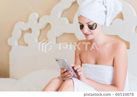 Beautiful woman wrapped in towel after morning 66510078