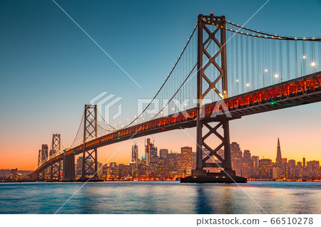 San Francisco skyline with Oakland Bay Bridge at sunset, USA 66510278