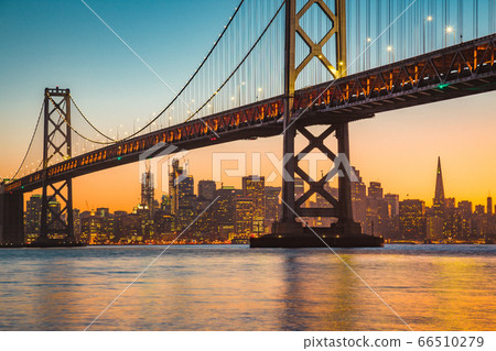 San Francisco skyline with Oakland Bay Bridge at sunset, USA 66510279